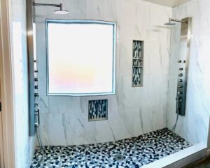 GTex double shower with tile walls, recessed niches and pebble floor